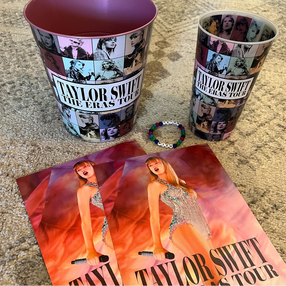 Eras AMC Movie Merch: pink popcorn tin, large cup, two mini posters, bracelet